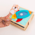 Jolly Designs. Rakieta. Książeczka sensoryczno-manipulacyjna