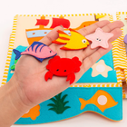 Jolly Designs. Podróżnik. Książeczka sensoryczno-manipulacyjna