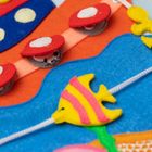 Jolly Designs. Magiczna Ryba. Tablica manipulacyjna. Książeczka sensoryczna