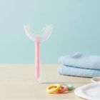 Bocioland, szczoteczka silikonowa w kształcie litery U do zębów, różowa