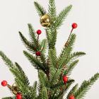 Homla, Stina, choinka, zielona w jucie ze złotymi i czerwonymi bombkami