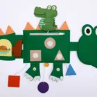 Jolly Designs. Krokodyl. Podróżna książeczka sensoryczno-manipulacyjna