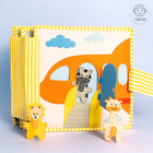 Jolly Designs. Podróżnik. Książeczka sensoryczno-manipulacyjna