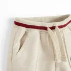 Cool Club, Spodnie dresowe chłopięce, beżowe, Harry Potter