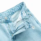 Jeansowe spodnie wide w stokrotki Cool Club