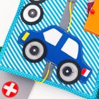 Jolly Designs. Zawody. Książeczka sensoryczno-manipulacyjna