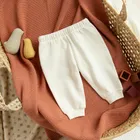 Cool Club, Spodnie dresowe niemowlęce, białe