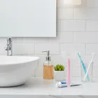 Bocioland, szczoteczka silikonowa w kształcie litery U do zębów, różowa