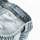 Jasne spodnie jeansowe o kroju slim z regulacją Cool Club