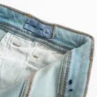 Jeansowe spodnie z regulacją o kroju flare Cool Club