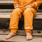 Spodnie dresowe dziecięce, musztardowe, Eevi