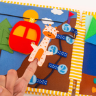 Jolly Designs. Podróżnik. Książeczka sensoryczno-manipulacyjna