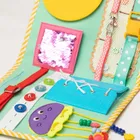 Jolly Designs. Kosmos. Tablica manipulacyjna. Książeczka sensoryczna