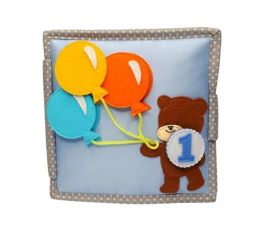 Jolly Designs. Sto lat! Książeczka sensoryczno-manipulacyjna