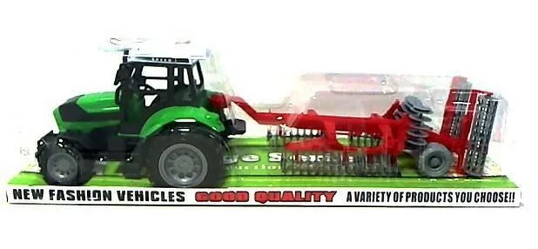 Maksik, traktor z czerwoną maszyną rolniczą