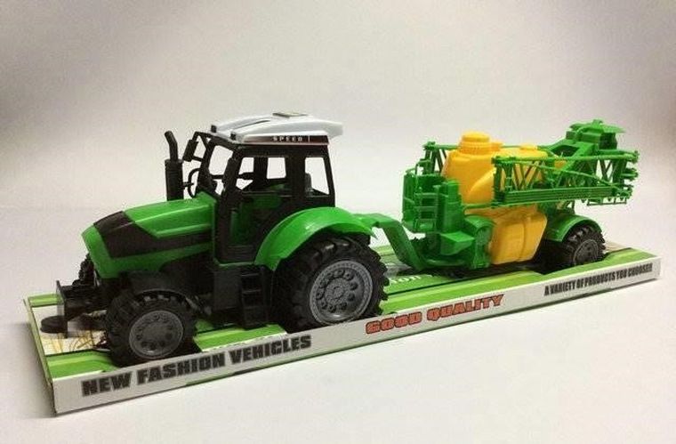 Maksik, traktor z zieloną maszyną rolniczą