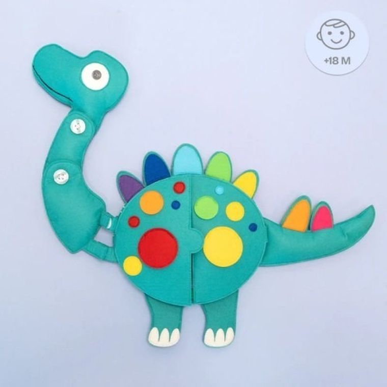 Jolly Designs. Dinozaur. Podróżna książeczka sensoryczno-manipulacyjna