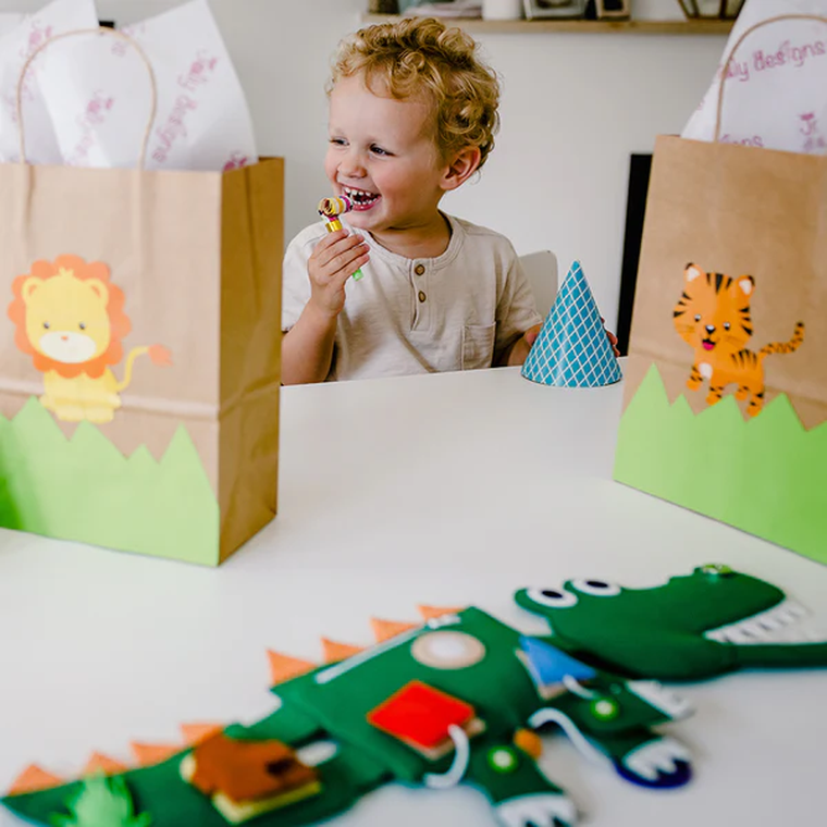 Jolly Designs. Krokodyl. Podróżna książeczka sensoryczno-manipulacyjna