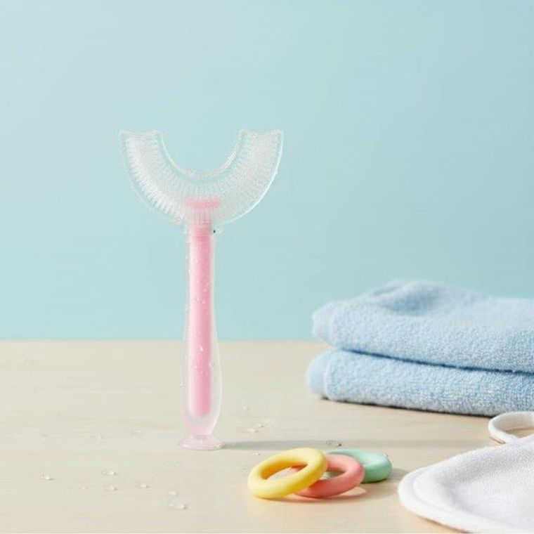 Bocioland, szczoteczka silikonowa w kształcie litery U do zębów, różowa