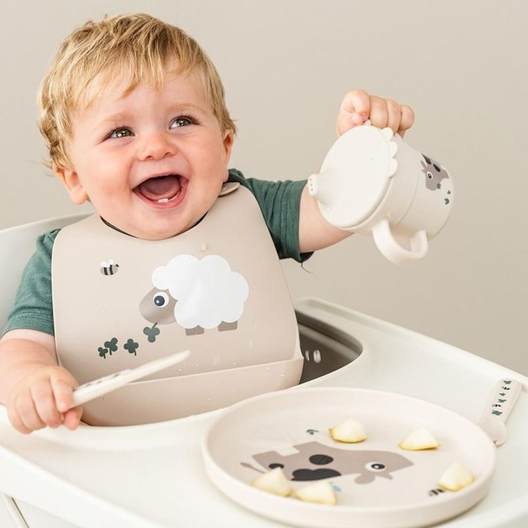 Done by Deer, Owieczka Sheepy, śliniak silikonowy z kieszonką, sand