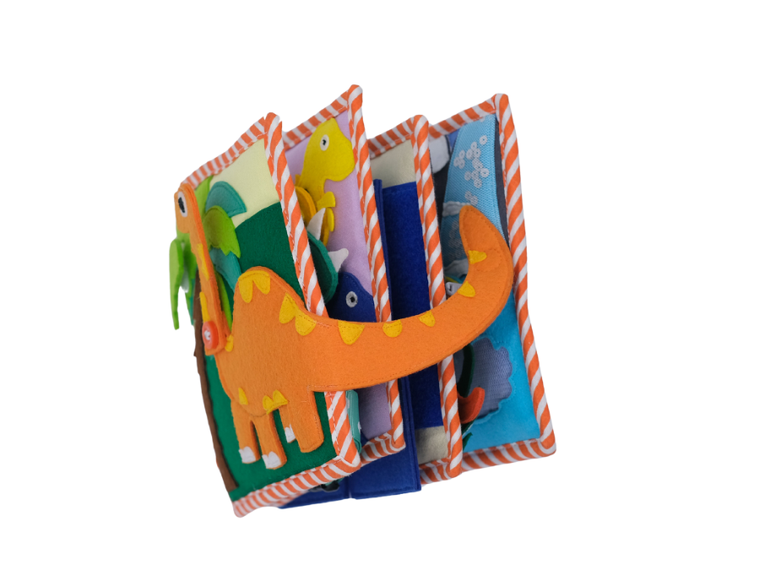 Jolly Designs. Dino. Książeczka sensoryczno-manipulacyjna