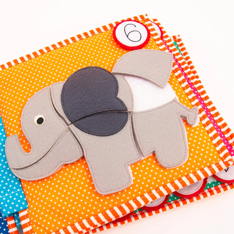 Jolly Designs. 1 2 3. Książeczka sensoryczno-manipulacyjna