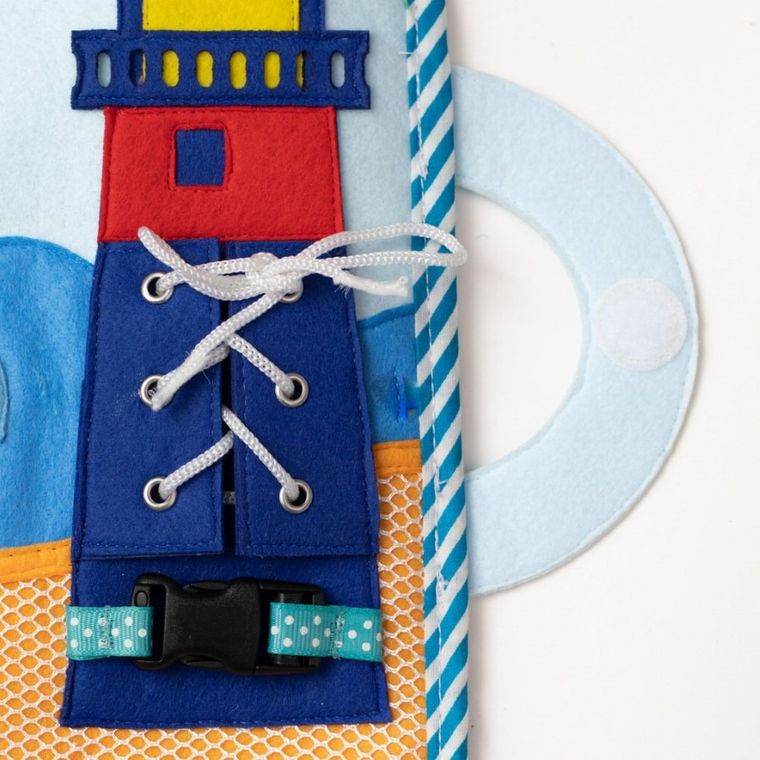 Jolly Designs. Magiczna Ryba. Tablica manipulacyjna. Książeczka sensoryczna