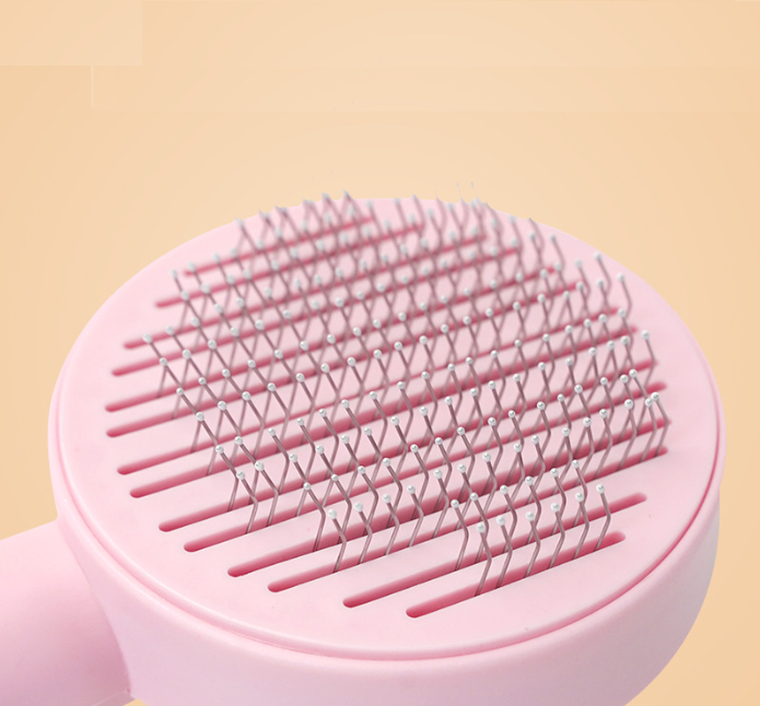 Szczotka do usuwania sierści psa lub kota, różowa