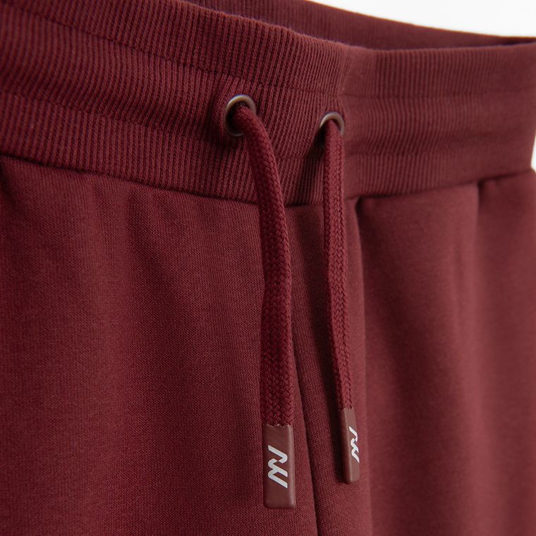 Bordowe spodnie dresowe unisex z szerokimi nogawkami NOWEAR